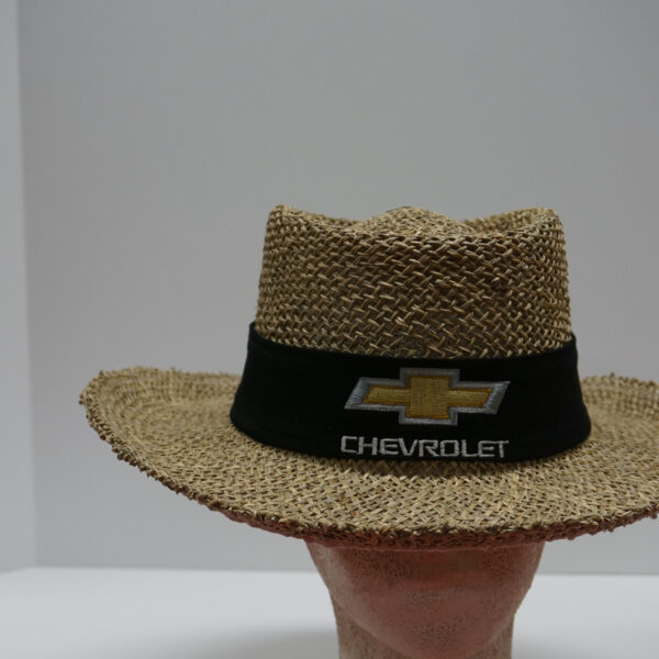 Straw hat on mannequin head with logo