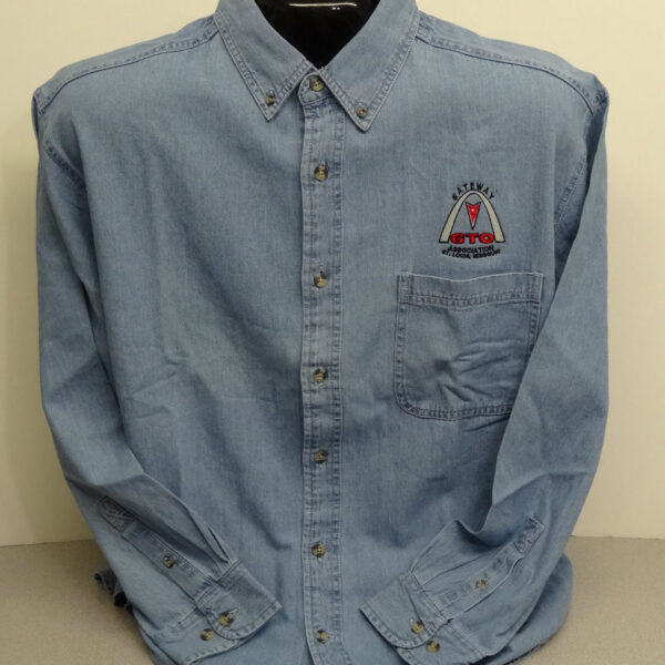 Embroidered blue denim shirt on display