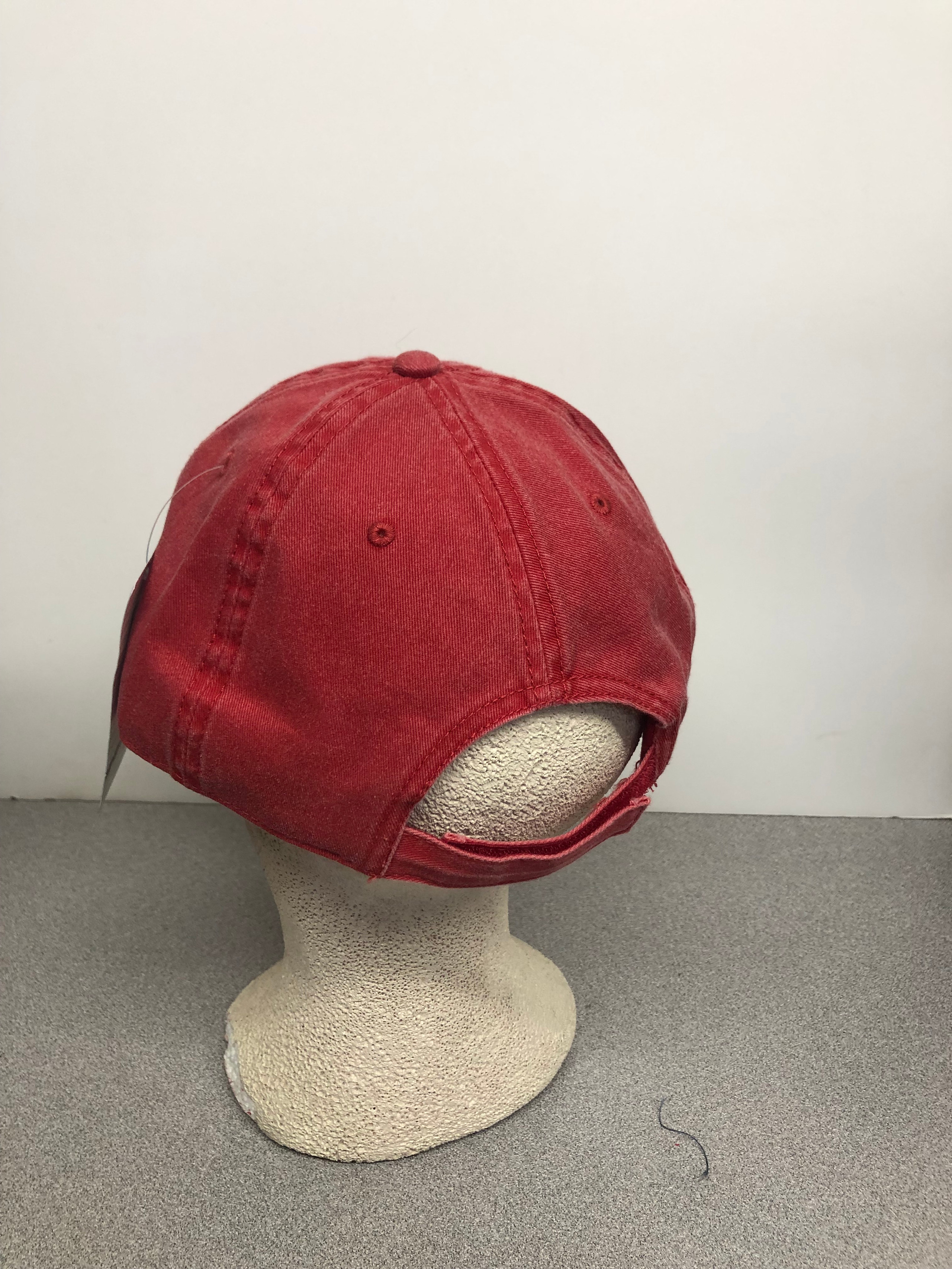 Red baseball cap on mannequin head