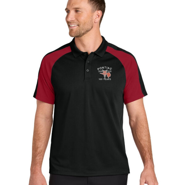 Smiling man in sporty polo shirt